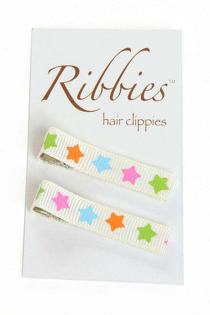 Barrettes anti-dérapante enfant blanches à étoiles.