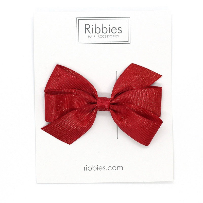 Discover our Medium Bow sparkly bow for girls in Red. Perfect hair accessory for Christmas!