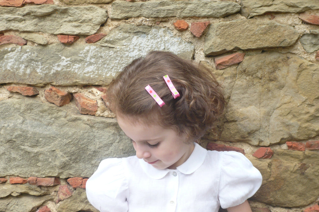 Barrettes anti-dérapantes fille blanches à étoiles.